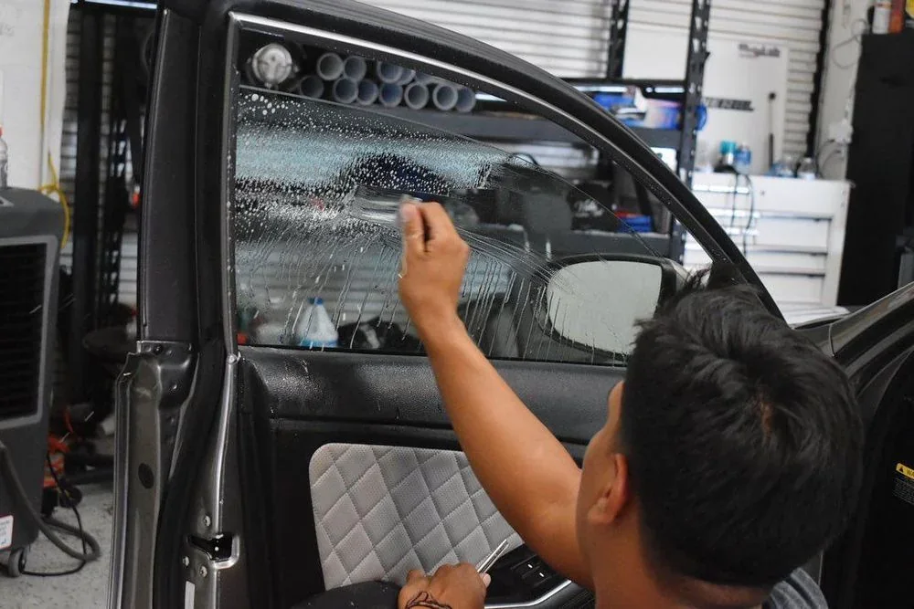Window film being fitted to a vehicle’s side window